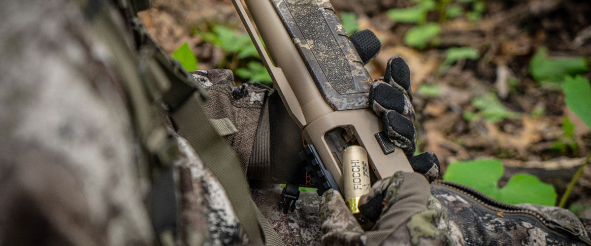 Fiocchi shotshell being loaded into a shotgun