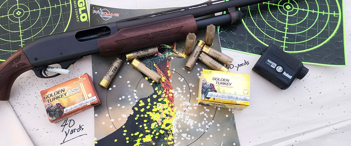 Golden Turkey boxes and shotshells next to a shotgun and a shot turkey pattern