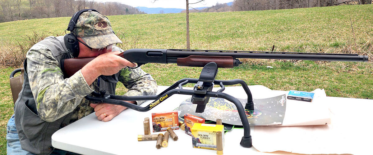 hunter aiming shotgun on a bi-pod